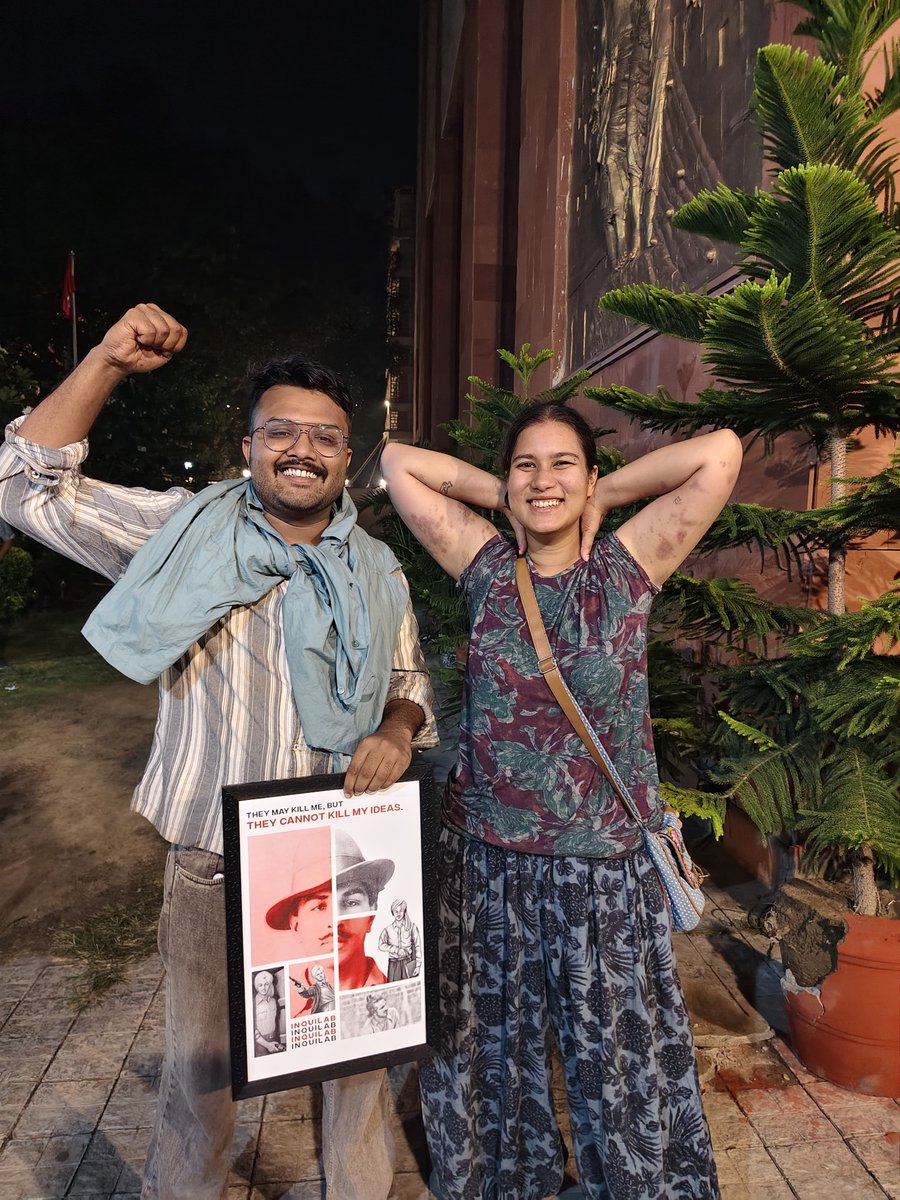 Noel__ben's tweet photo. You can't take our smiles away from us. Beat us, our fists shall always be raised. Tear our shirts, we shall convert it into mufflers. Tear Bhagat Singh's photos, we shall keep him alive through our struggles and lives! 
With my President, comrade Nadia. https://t.co/CGpwbnZCUd