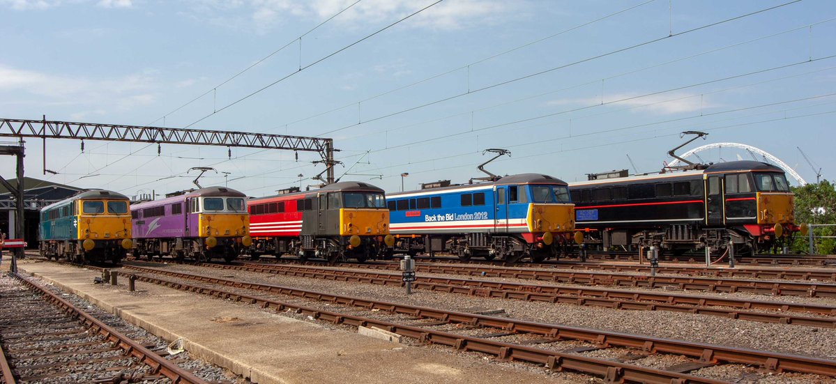 railexpress's tweet photo. From the Editor's archives:  One from those days when Virgin Trains knew what publicity meant, and had events for the trade press. 

A curtain call of its different liveried Class 87s at Wembley depot on June 28, 2005. From left: 87001, 87002, 87010, 87012 and 87012. https://t.co/dWsRSOGZIX
