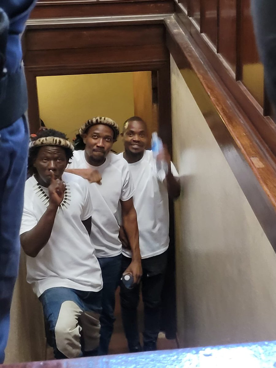Durbannetwork's tweet photo. Magolide, Wandile Nsibande and a third accused are at court, currently downstairs before proceeding to the courtroom. They are represented by Xolani Zuma of March and March and SA 1st Forum.

#DurbanUprising https://t.co/zPX06Lv99P