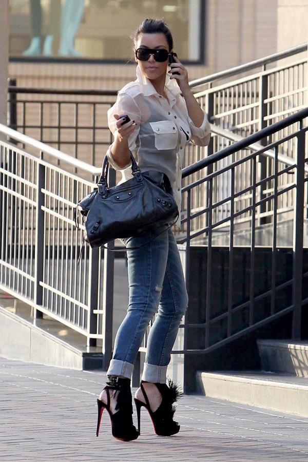 kimkfair's tweet photo. kim kardashian on january 29, 2011, while out shopping in los angeles, california, wearing 5.7-inch christian louboutin “change of the guard” black suede fringe platform heels https://t.co/2NvLlKJdCn