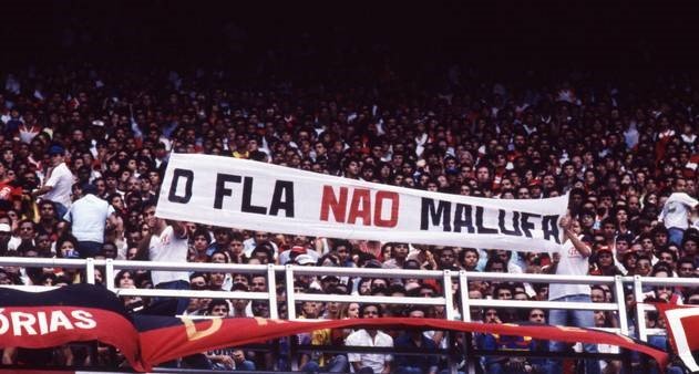 marifrancoramos's tweet photo. Arquibancada é espaço de disputa, assim como as redes e as ruas. As organizadas do Flamengo nasceram na ditadura com punho cerrado. Teve Fla Diretas, o Fla Não Malufa, bandeirão da Marielle, Stuart Angel Vive. A Nação 12 leva a faixa contra a 6x1. Quem torce é trabalhador. É 13! https://t.co/p5ESWkPRL0