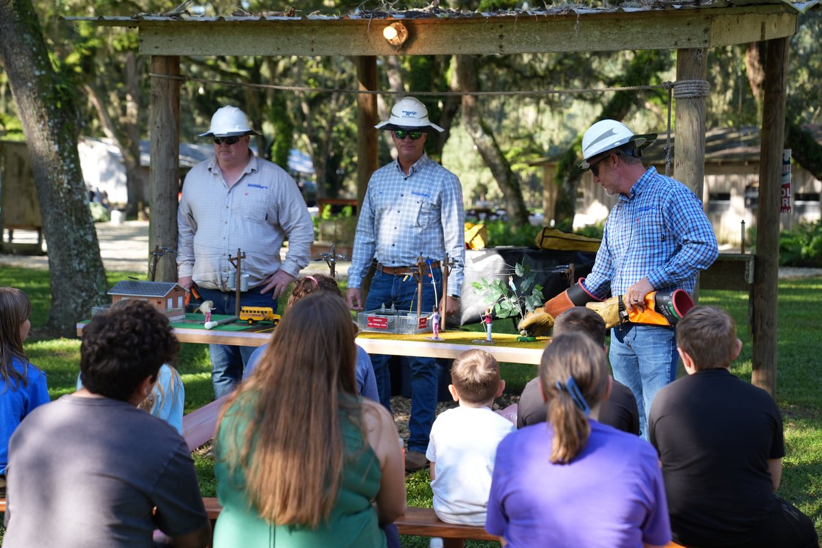 WRECCoop's tweet photo. 🌾⚡ WREC was proud to participate in the Pasco County Cattle Women’s Youth Farm Safety Day! Our Safety Department and One Pasco Center crew taught students about power line safety, underground transformers, lineworker equipment, and PPE. Building a safer future through education https://t.co/tZlDsavpGL