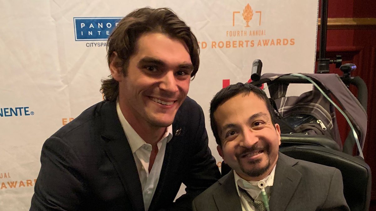 asing87's tweet photo. WTF?! 😳 I remember meeting @RjMitte at @TheCILOfficial’s 4th Annual Ed Roberts Awards gala back in January 2020. He was really nice, and we even took a photo together. I still remember that moment! #RIPRJMitte https://t.co/lyFPUTUj1K