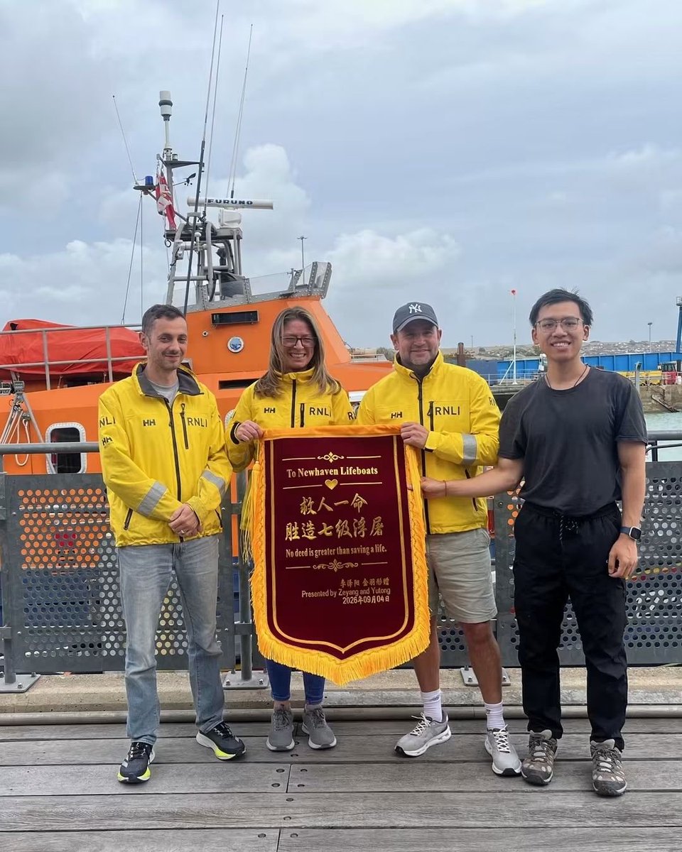 CurtExplores's tweet photo. In May, two Chinese students were caught out by the tide on the Sussex coast. 

They got the attention of a passing boat with their camera flash &amp; were rescued by Dan, Kath, Steve &amp; Rich of Newhaven @RNLI.

Last month, Zeyang returned with a锦旗 for those who saved his life. https://t.co/b9U6WHlYcw