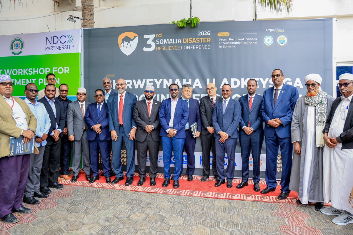 MoIFARSomalia's tweet photo. The Minister of Interior, Federal Affairs and Reconciliation, H.E. @AliYusufHosh, officially opened the 3rd edition of the Somalia Disaster Resilience Conference (SDRC 2026) in Mogadishu, bringing attention to a critical national priority: integrating disaster resilience into how Somalia plans, governs and develops.

As recurring droughts and floods continue to disrupt communities, livelihoods and public services, strengthening resilience requires more than emergency preparedness. It calls for coordinated institutions, risk-informed planning and stronger links between scientific evidence and government decision-making.

The Conference brings together research, policy and practical experience to help shape a more proactive approach to disaster risk management, where national and local institutions are better equipped to anticipate shocks, protect development gains and support communities in building lasting resilience.

The Minister acknowledged SoDMA, Mogadishu University, researchers and partners for their contributions to advancing this important national dialogue.