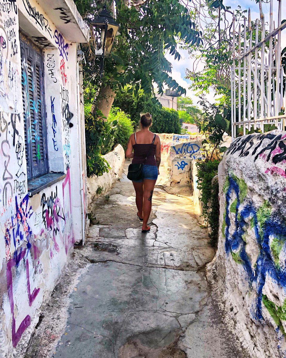 CabreKarina's tweet photo. On our way to the Acropolis in Greece, we stumbled upon this charming hidden path up the mountain, leading to the iconic landmark ahead. https://t.co/N2nOBDUN8f