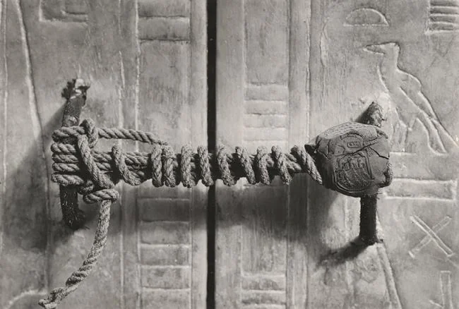 Rainmaker1973's tweet photo. The unbroken seal on King Tutankhamun’s tomb in 1922. 

That piece of rope and clay remained entirely untouched for 3,245 years before this photo was taken. https://t.co/TQ3MRaSyqE