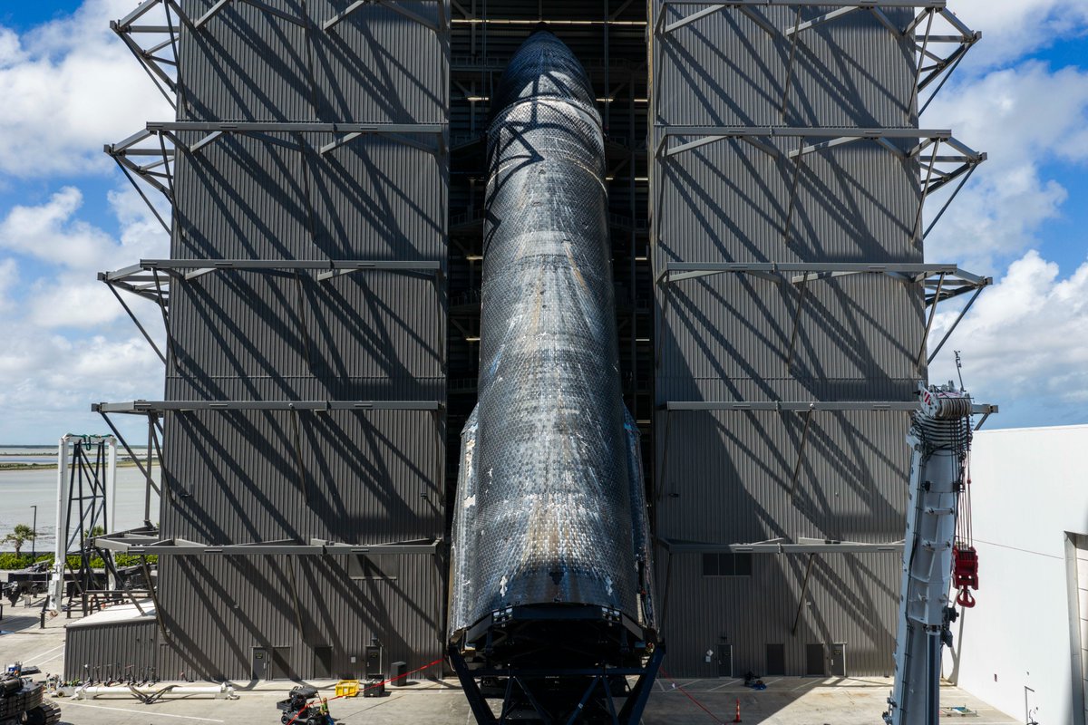 SpaceX's tweet photo. The first Starship to return to its launch site, Ship 40's journey took it across air, space, and sea. Now that it is vertical alongside three other Starships in a Megabay at Starbase, it will provide first-of-its-kind data on a flown Starship heatshield, Raptor engines, avionics, and more.