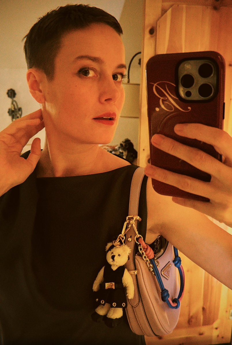 ThBriLarson's tweet photo. Twinning with my @Prada teddy bear bag charm 🖤 https://t.co/sD56OQgWQm