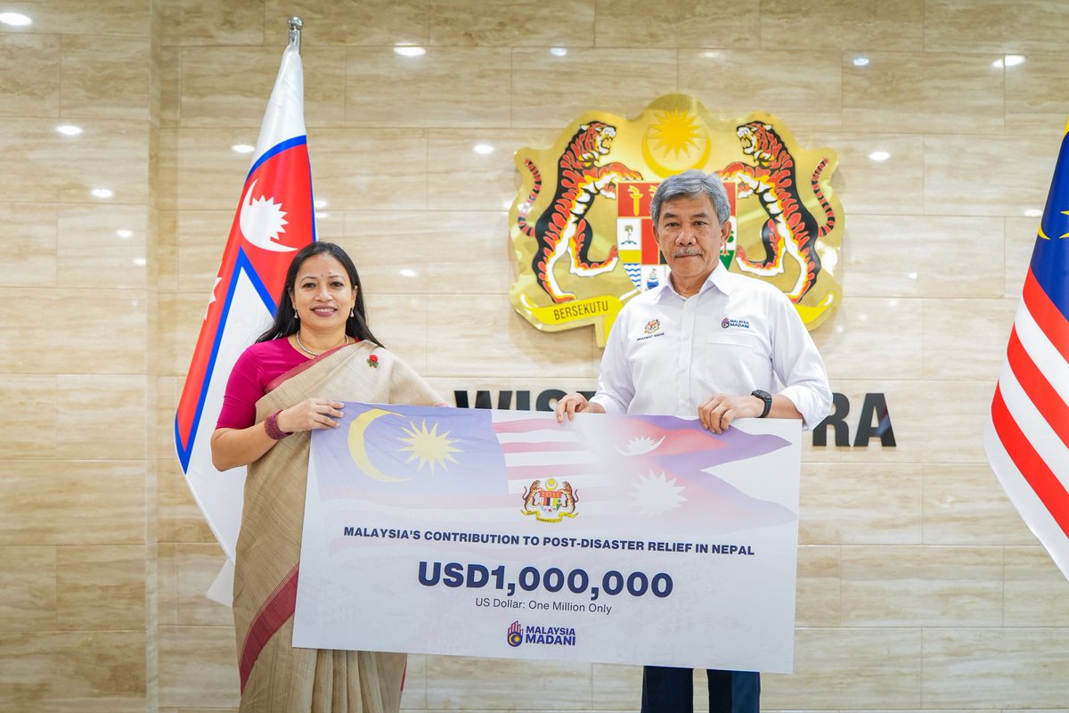 MalaysiaMFA's tweet photo. On 14 October 2026, Minister of Foreign Affairs, Dato’ Seri Utama Haji Mohamad bin Haji Hasan presented Malaysia's humanitarian contribution of USD 1 million to the Chargé d'Affaires a.i. of the Embassy of Nepal in Kuala Lumpur, Ms. Mudita Bajracharya. https://t.co/OTtMjqUWDT