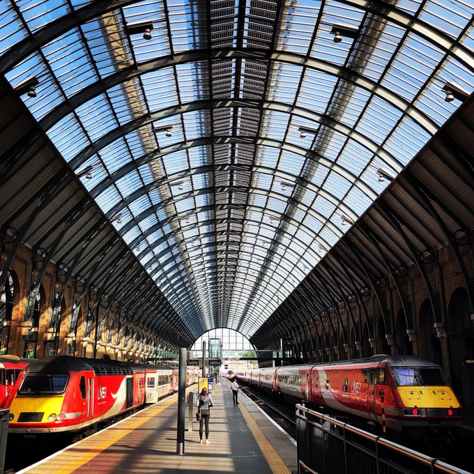 Under one of the pair of impressive barrel vaulted roofs at Kings Cross in 2019 three mainstays of the East Coast mainline are visible, a Class 43314 InterCity 125 on the left, a Class 91 Driving Van Trailer (82206) on the right as a then-new Class 800 Azuma arrives in the centre.