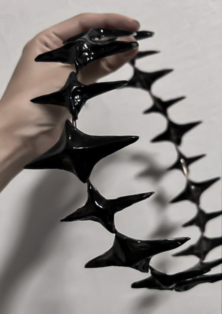 gothicornate_'s tweet photo. dark, glossy statement pieces with sharp spikes and demonic, otherworldly designs. https://t.co/O18SfwkxpU