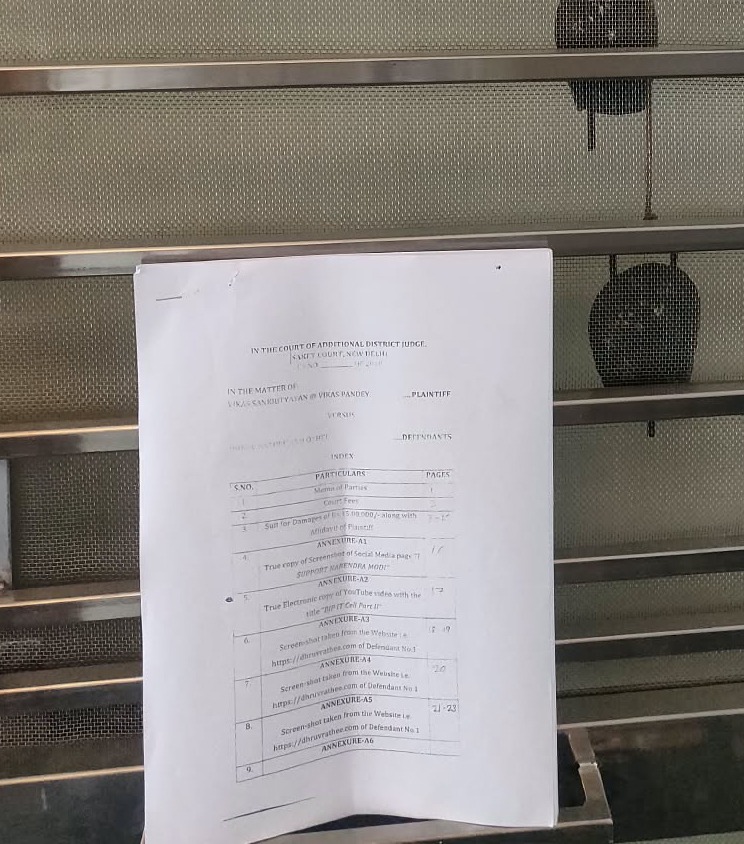 ians_india's tweet photo. A Saket court has ordered fresh summons to YouTuber Dhruv Rathee at a Gurugram address in a case filed by Vikas Sankrityayan, also known as Vikas Pandey. The court allowed dasti service, permitting the complainant to accompany the process server. The next hearing is scheduled for October 17