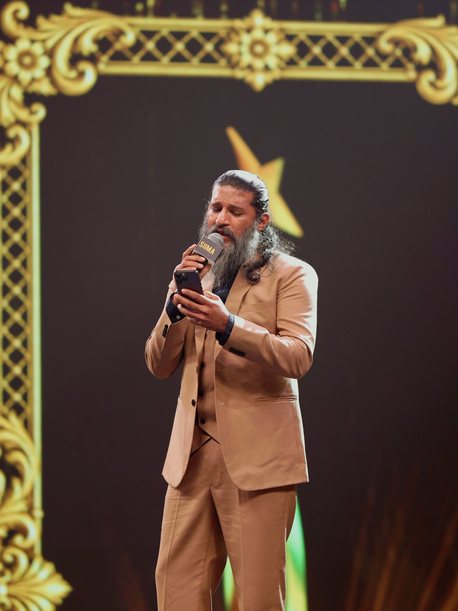 siima's tweet photo. Lost in the magic of music 🎶❤️ @IAMVIJAYYESUDAS soaking in the moment with a soulful rendition of Iragey after winning Best Playback Singer Male for Tourist Family at SIIMA 2026.

#NEXASIIMA2026 #VijayYesudas #TouristFamily #Iragey #SIIMA2026 https://t.co/LwFeMVupBO