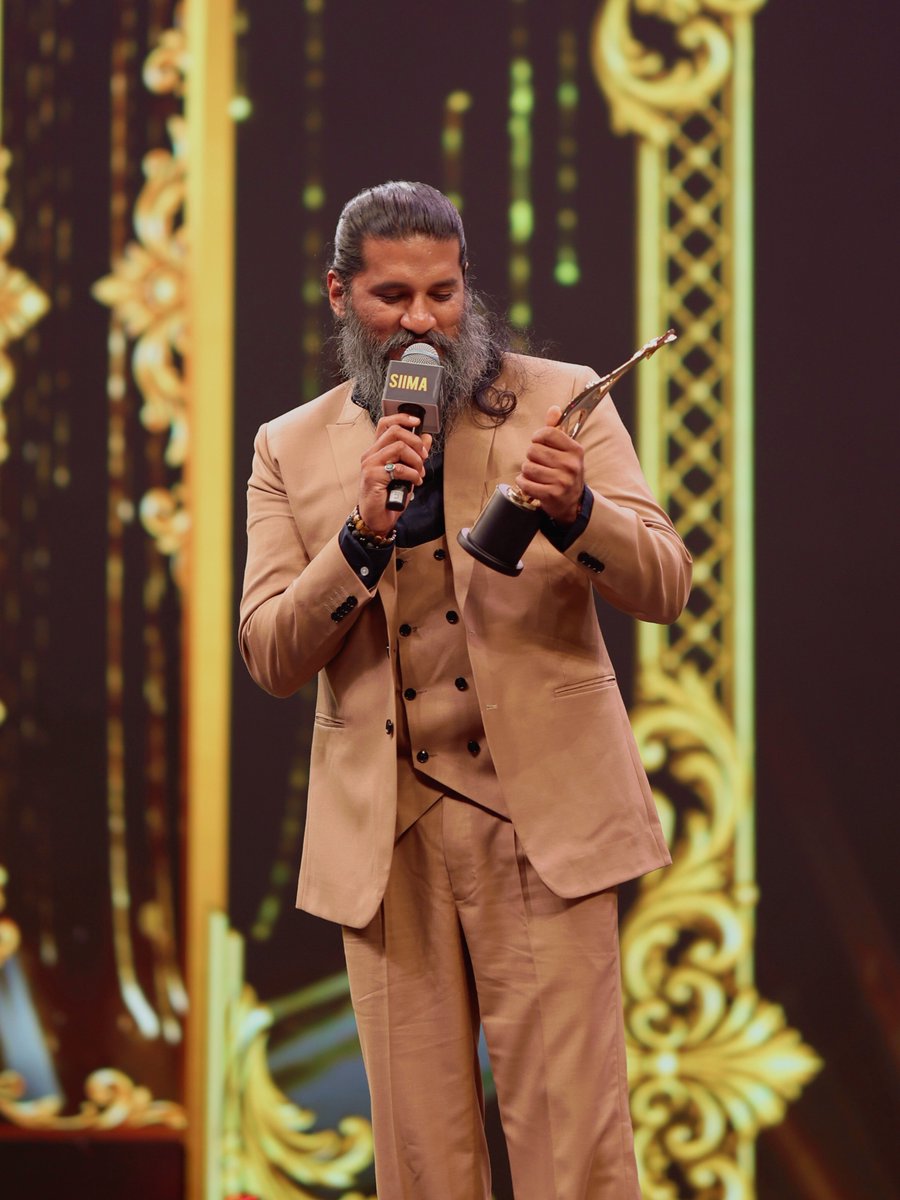 siima's tweet photo. Lost in the magic of music 🎶❤️ @IAMVIJAYYESUDAS soaking in the moment with a soulful rendition of Iragey after winning Best Playback Singer Male for Tourist Family at SIIMA 2026.

#NEXASIIMA2026 #VijayYesudas #TouristFamily #Iragey #SIIMA2026 https://t.co/LwFeMVupBO