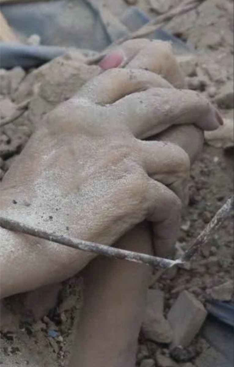 PawlowskiMario's tweet photo. Hey @elonmusk, you are now responsible for this. 

Dead mother holds her dead child hand in the rubbles of the city in Ukraine after Russian missile/drone attack on the civilian targets. https://t.co/AUCVFeGQxj