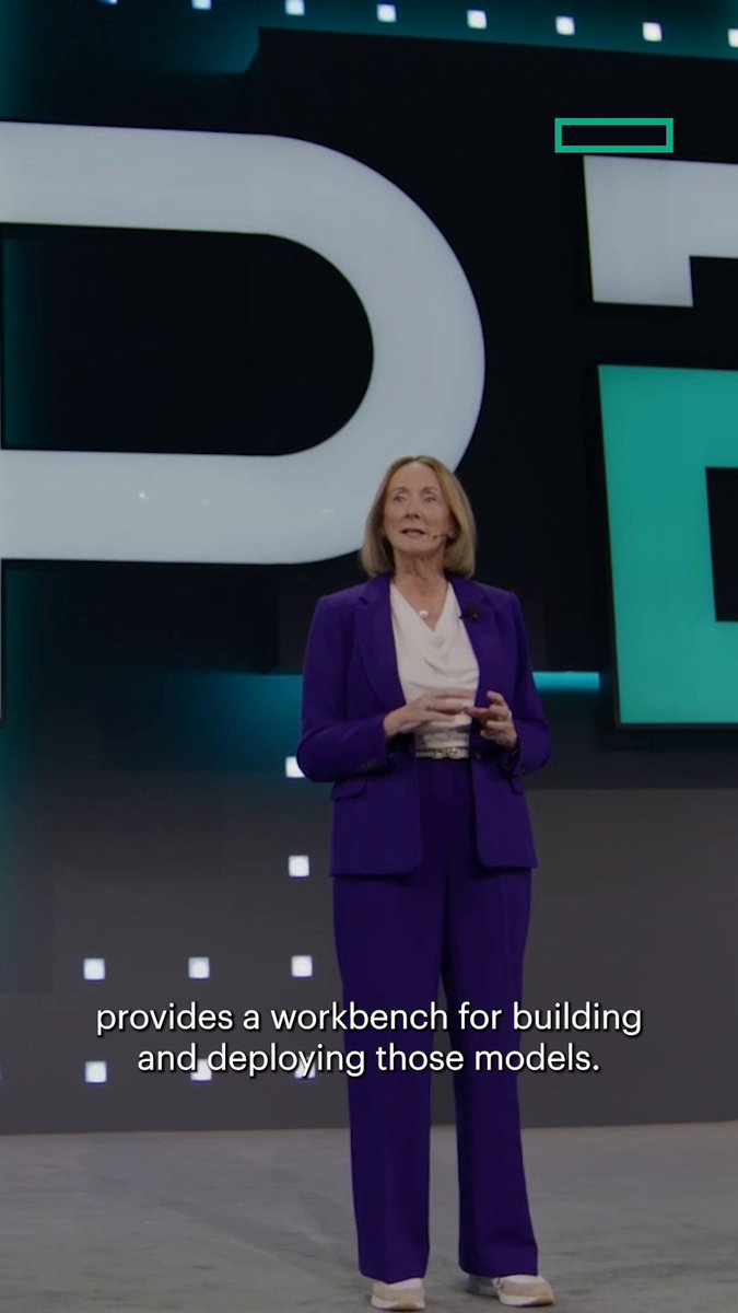 A woman in a purple pantsuit presents on a stage with a large "DG" or "DF" logo behind her, with subtitles reading "provides a workbench for building and deploying those models."