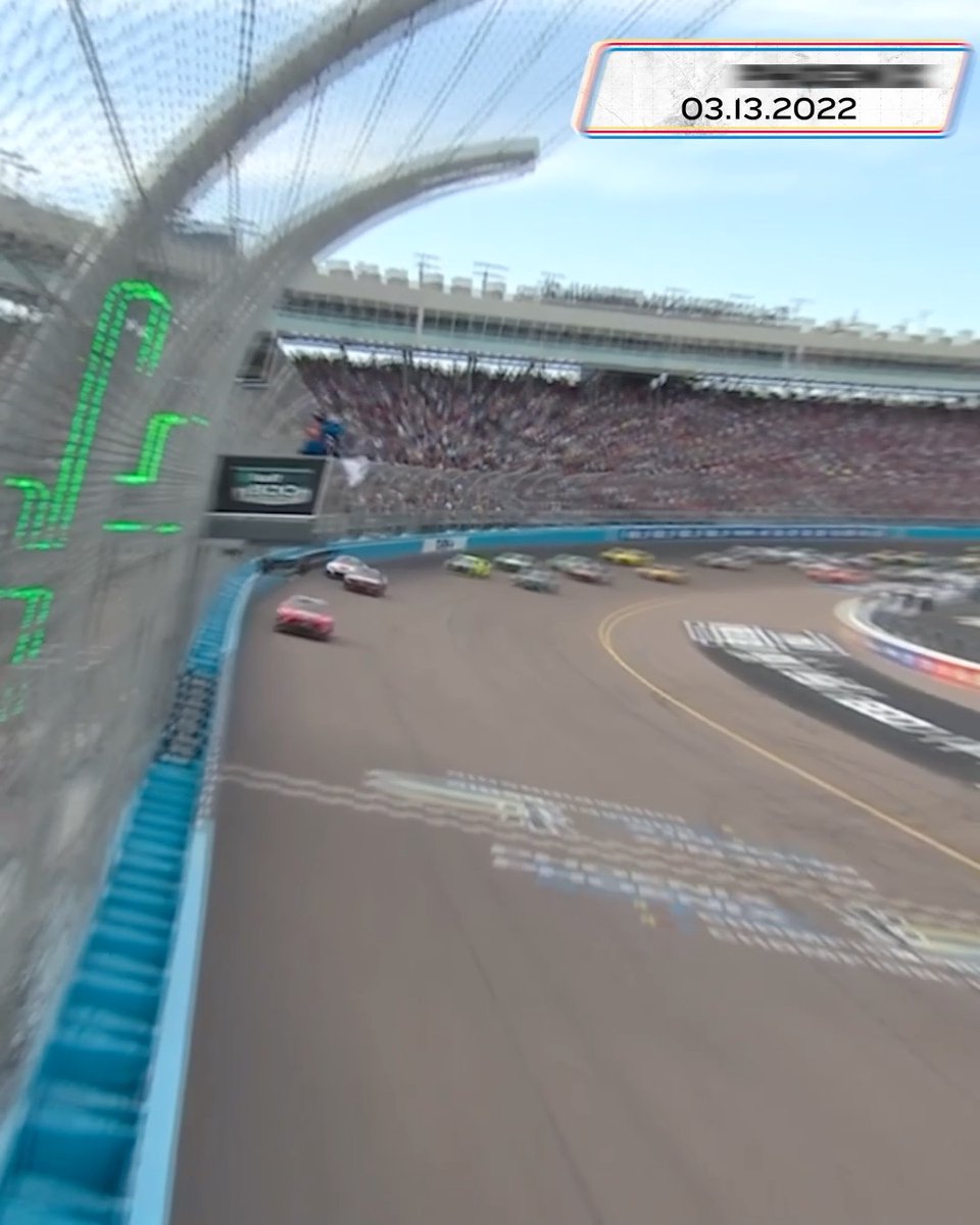 A NASCAR race at Phoenix Raceway with cars speeding around the track, dated 03.13.2022, capturing the action of Chase Briscoe competing at the venue shown in the post.
