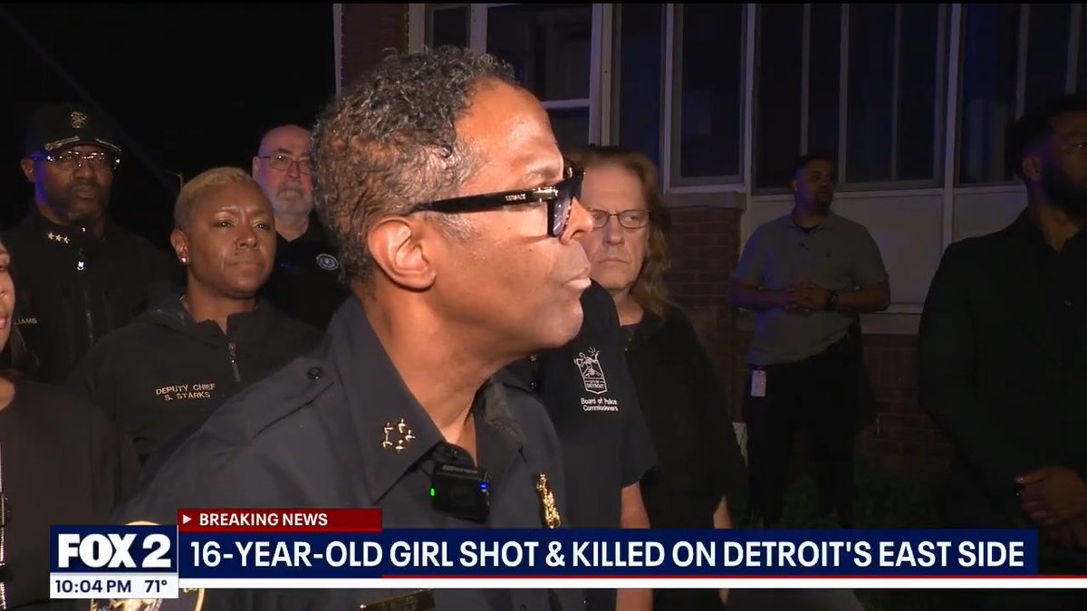 A Fox 2 news broadcast at 10:04 PM featuring a breaking news segment titled '16-YEAR-LD GIRL SHOT & KILLED ON DETROIT'S EAST SIDE', showing a female police official speaking outdoors with Deputy Chief D. Starks and other officials in the background.