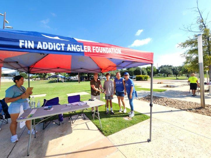 SSFCU's tweet photo. Security Service volunteers joined the #FinAddictAnglerFoundation for a fun catch-and-release tournament. From untangling lines to measuring catches for 71 young anglers, our crew had an awesome time bringing our People Helping People spirit to the park! 🏆 

#peoplehelpingpeople https://t.co/Fnw6yDX2T9