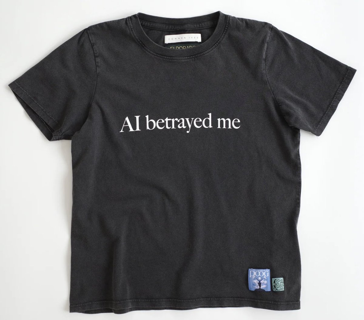 alexia's tweet photo. My Large “AI betrayed me” shirt has people asking a lot of questions already answered by my shirt. https://t.co/RJY1Ms7nKa https://t.co/6hOy7ygIN4