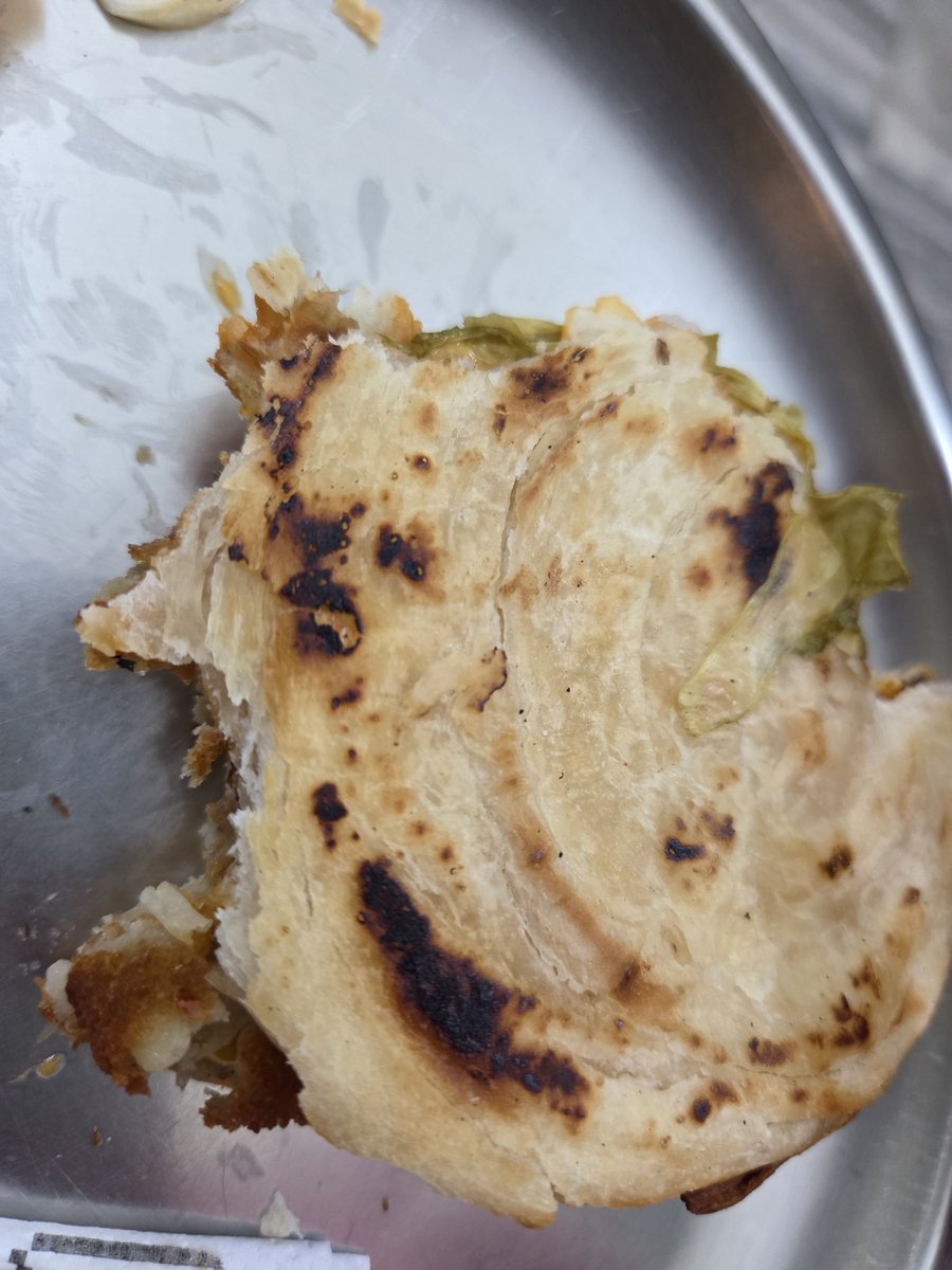 Dia_Jainn's tweet photo. Swiggy never fails to disappoint! @Swiggy @SwiggyCares doesn't care because I had ordered a Faasos paratha burger which was burnt on the outside and raw from inside (thick uncooked layers of lachha paratha) and tasted awful. I waited and waited in chat but no resolution 😠 https://t.co/u9AhV5eHYk