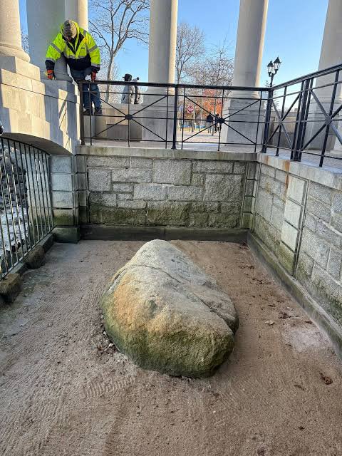 histories_arch's tweet photo. Plymouth Rock is a famous 600-million-year-old Dedham granite boulder in Plymouth, Massachusetts, that has long been celebrated as the traditional landing site of the Mayflower Pilgrims in December 1620...

The Mayflower Pilgrims never mentioned Plymouth Rock in any of their journals or writings. Neither William Bradford nor the other surviving early accounts mention the Pilgrims stepping onto a particular rock. They actually made their first North American landfall further north at Cape Cod before arriving in Plymouth. The tradition was first recorded more than a century later, when 95-year-old Thomas Faunce reportedly identified the boulder in 1741 as the place his father’s generation had associated with the landing. Faunce spoke up to save it from being buried by a new wharf.

During the American Revolution in 1774, townspeople tried to haul the boulder to the town square to support the patriot cause. The rock split in two during the move. Locals viewed the fracture as a sign of the colonies breaking away from Great Britain. The upper half was hauled into Plymouth’s town square, then moved again to Pilgrim Hall in 1834, while the lower portion remained near the waterfront. 

In 1880, the top portion was moved back down to the waterfront and reunited with the bottom half, and the year 1620 was carved into it. Housed under a classic portico designed by McKim, Mead & White at Pilgrim Memorial State Park, the rock now weighs about 10 tons—a fraction of its original size of up to 200+ tons.

Over the centuries, souvenir hunters chipped pieces off the rock, and it was moved multiple times between the harbor, town square, and the Pilgrim Hall Museum.

#archaeohistories