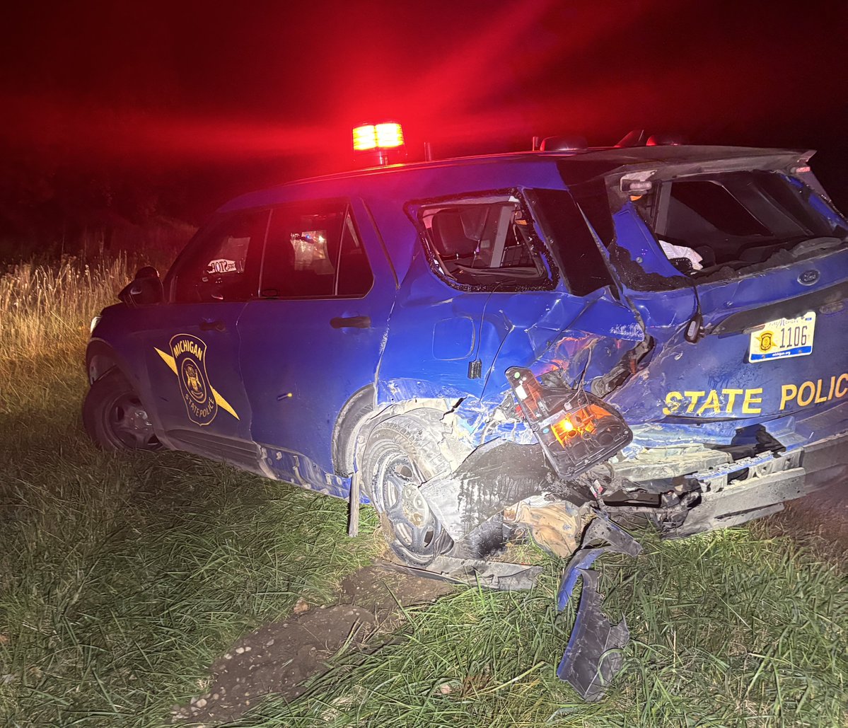 MSPFirstDist's tweet photo. Lansing Post Trooper Patrol Vehicle Struck By Motorist

October 15, 2026

Windsor Township, Eaton County-On October 14, 2026, at approximately 10:55 p.m., troopers from the Lansing Post were on westbound I-96 near Lansing Rd attempting to pull a semi-truck out of the ditch.  

Troopers had shut down the right lane of travel for the tow truck and positioned a patrol car in the right lane with its emergency lights activated, as well as flares on the roadway.  Traffic was still moving in the left lane of travel.

At that time a 2013 Chevy Cruze being driven by a 67-year-old male from Dewitt, moved to the right lane intending to pass a semi-truck in front of him. The vehicle came upon the unoccupied patrol vehicle and struck it from behind. After striking the patrol vehicle, the vehicle continued into the left lane and was struck by the semi-truck he was trying to pass. 

No troopers were injured in the crash. The driver of the Chevy Cruze sustained serious, but non-life threating injuries, and was transported to University of Michigan Hospital in Lansing for treatment. The driver of the semi-truck was not injured.

The crash caused the roadway to be closed for several hours as troopers investigated the crash and clean up the roadway.

The investigation is ongoing.