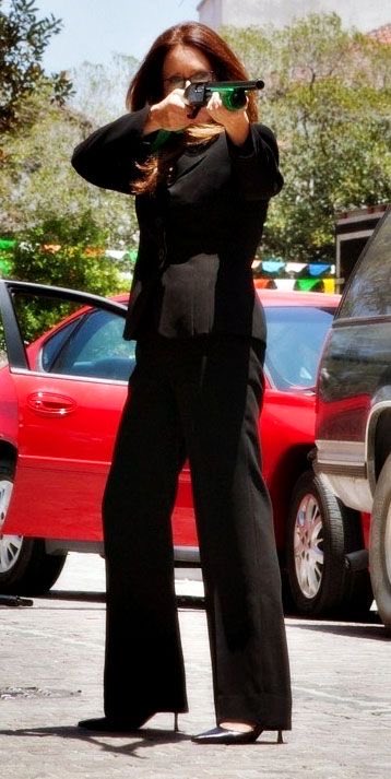 bebeneuwirths's tweet photo. like yes she is shooting a man between the eyes with a bean bag gun but can we appreciate the impeccable tailoring of this suit?? https://t.co/KqpRXGtEir