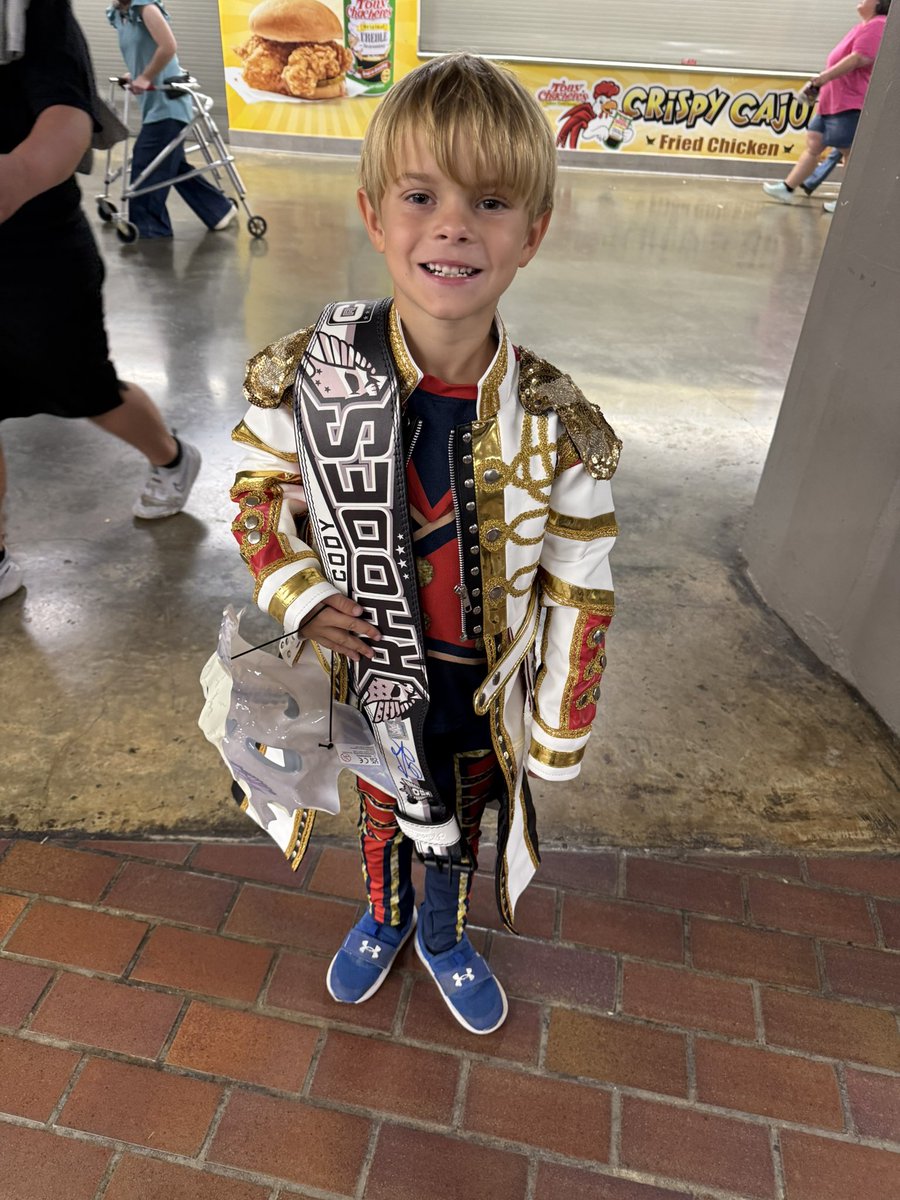 CodeMan316's tweet photo. THANK YOU, @CodyRhodes for being you. 

You give back to the fans every night! 

You sure made my son’s night when you picked him for the signed weight belt! 

We will always be your biggest fan! ❤️🤍💙 https://t.co/vMyD4USpc7