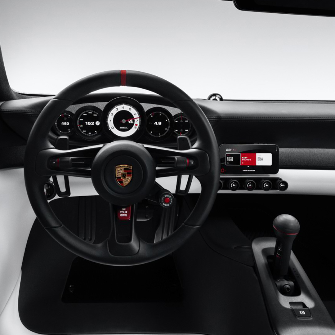 carwowuk's tweet photo. REVEALED: Porsche Mission S!

Porsche has officially unveiled the Mission S, an all-new mid-engined super sports car platform positioned above the 911!

🏎️ All-new petrol-powered mid-engined supercar platform!
📐 Retro-inspired design blending 911 headlights, GT1 lower front, and a 959-style sloping roofline!
🔥 May pair the 911 Turbo's engine with a motor for 1,000+ hp!
🌀 Rear cooling fan sticking out of the bodywork!
🕹️ Pure analogue focus with 5 round instruments, physical HVAC controls, and a big red traction-off button!
📱 Ditches central touchscreen displays for a minimalist, retractable MagSafe phone mount setup!

Can the Mission S really rival the legendary Carrera GT and 918 as the best Porsche ever? 🏎️👑
