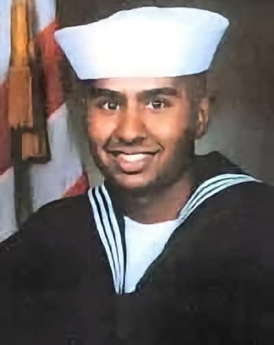 Daytobehappy's tweet photo. I have undertaken this project to put a face to 9/11 by posting a photo of everyone killed that day. If after everything that happened you can vote for the ideology that brought it about it's as if you are killing them yourself! Pictured below was 23 year old Kris Bishundat who was killed in the Pentagon after Flight 77 crashed into it. He was due to turn 24 in 3 days and had moved with his family from Guyana to the United States in 1980. He enlisted in the Navy in 1995 and during that time was awarded a number of medals including the Navy Commendation Medal and the Defense Service Medal. At the time of the 9/11 attack he had been working in the Pentagon as a systems technician since May 2001. To forget a single one of these people is a blasphemy!