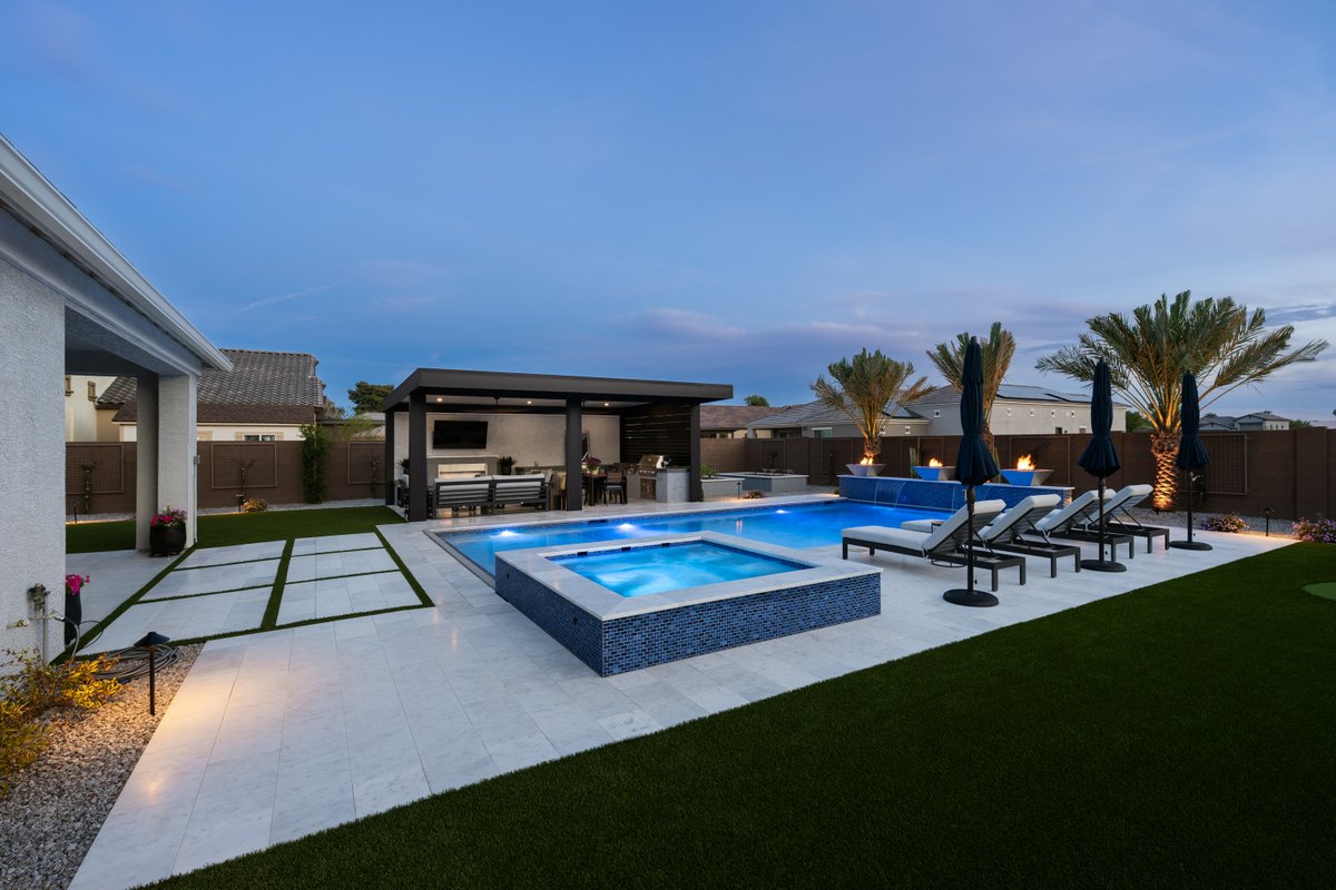 calpool's tweet photo. This Peoria Paradise is a 2026 World's Greatest Pools award winner! 🏆 

The Electric Blue Sea Glass Pebble interior sparkles brilliantly in the sun and glows with vibrant blue in the evenings. Congrats to Designer Paul Swirski &amp; our team who helped bring this backyard to life! https://t.co/ZJ3a1A0bqb