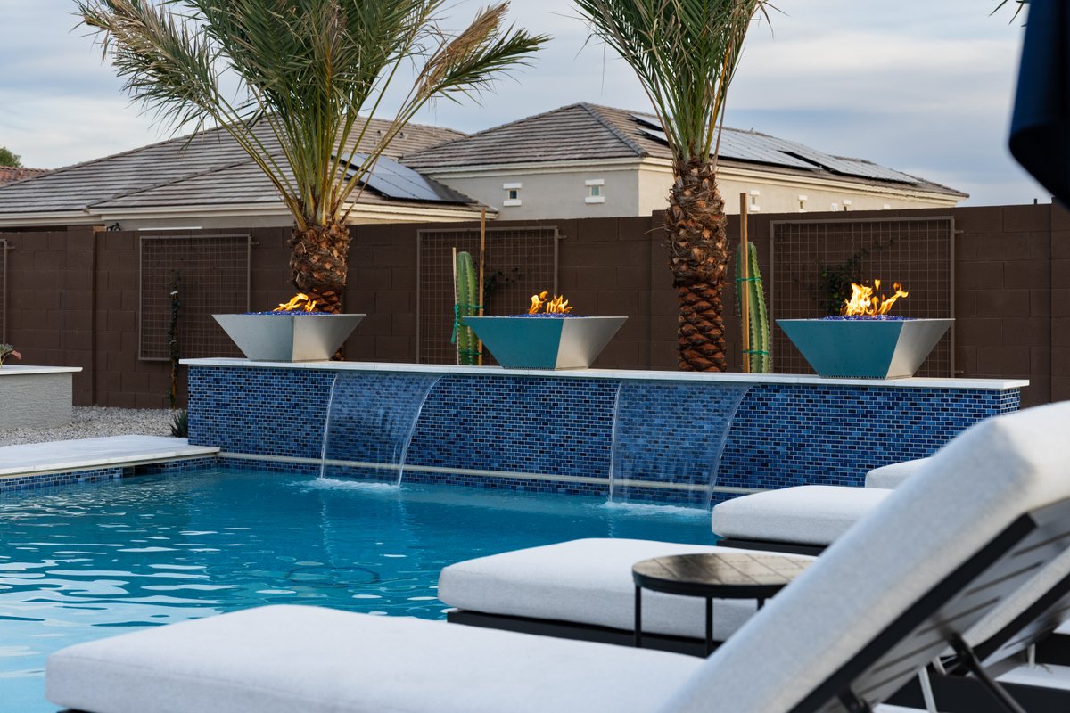 calpool's tweet photo. This Peoria Paradise is a 2026 World's Greatest Pools award winner! 🏆 

The Electric Blue Sea Glass Pebble interior sparkles brilliantly in the sun and glows with vibrant blue in the evenings. Congrats to Designer Paul Swirski &amp; our team who helped bring this backyard to life! https://t.co/ZJ3a1A0bqb