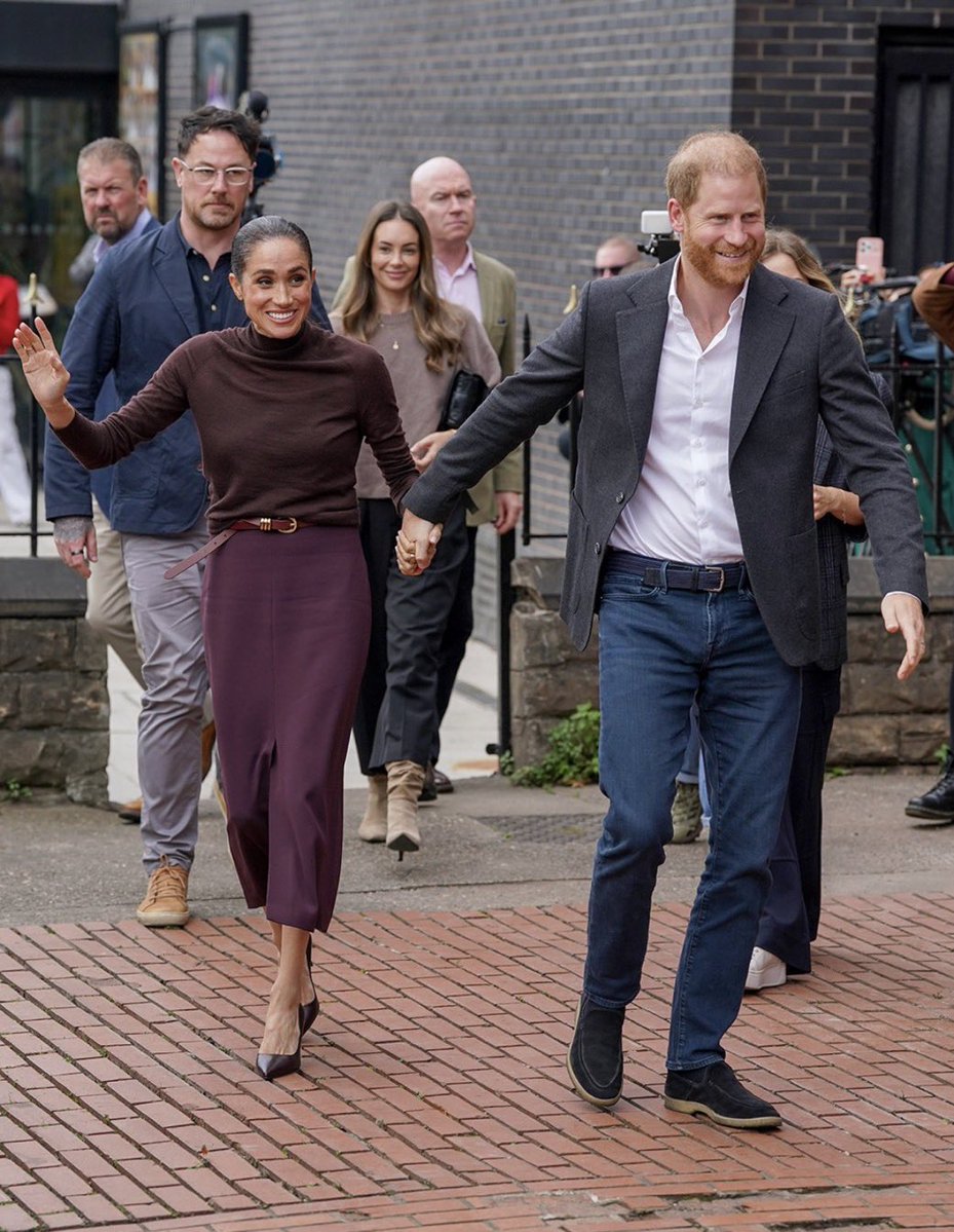QLoTII's tweet photo. One more on Nottingham, because the irony hasn't been said plainly enough.

In 2020 they told the world the job was unbearable. The engagements, the handshakes, the crowds, the cameras, the whole royal-tour routine. It was crushing her. They had to leave. Oprah got two hours on it.

Yesterday they drove to Nottingham and did the job. Three charities, a crowd, flowers, selfies, a workshop, the wave. The exact thing they fled, done from memory, with none of the things that made it worth doing. No role. No title that means anything. No regiment, no patronage, no Palace behind them. Not even the thank-you note from the Lord Chamberlain afterwards, because the Lord Chamberlain wrote last month to say they don't work here.

It was a tribute band playing the hits of a group that said the music was killing them.

And the performance. Meghan is an actress; it's the one job she trained for and it showed. The tears at the bouquet arrived on cue. The 'it's great to be back' was pitched for the microphone, not the woman in front of her. The hug, the hand on the heart, the eyes doing the thing. Everyone who has watched her for nine years has seen that sequence before, on better days, with better lighting. It isn't that she felt nothing. It's that you could see her deciding what to feel.

Here's how the public reads a day like that, and I've read the replies so you don't have to. People who already loved them loved it. Everyone else saw a couple who left a country for its own good, came back when the money thinned, and are now cosplaying the life they said was unlivable, in the same city, in a coat the same colour, hoping nobody checks the dates.

Nobody is angry anymore. That's the defeat. Anger would mean it mattered. What they got instead was a country watching a rerun, recognising every scene, and quietly changing the channel to the real one.