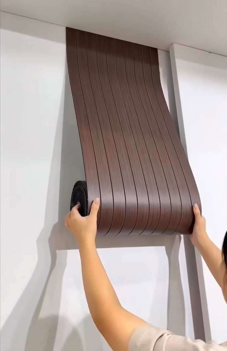 alluraxx's tweet photo. PLAIN WALL TO EXPENSIVE-LOOKING WALL REAL QUICK?! 😭🤎 

These flexible wood-look panels are SUCH a good find! The vertical lines + dark brown shade + warm lighting combo?? Parang instant hotel-luxe vibes without changing the whole room. 🥹✨ https://t.co/D9ryZ2aXOa