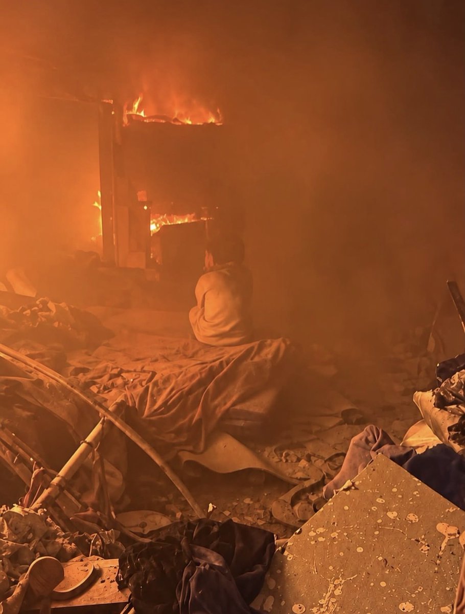 wizardbisan's tweet photo. Why? 
Context: she is a 3 years old orphan who lost her father at the beginning of the genocide, and in this photo two days ago she is staring at her mother burning to death in an air strike by the Israeli army in Gaza Strip.
So.. Why? https://t.co/DBLxDzakU4