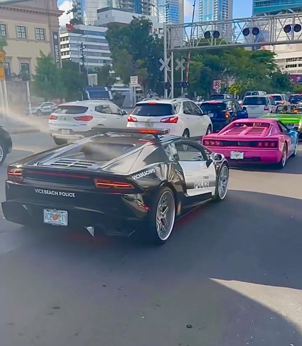 GTASixInfo's tweet photo. Rockstar appears to be bringing GTA 6’s cars into the real world for its Miami marketing.

A real-life Coquette has been spotted driving with a Vice City style wrap and Leonida license plate, alongside a Lamborghini wrapped in Vice Beach Police livery.

(via IG/andrewblakeames) https://t.co/Zyq3q2ndfP