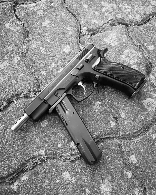 DocStrangelove2's tweet photo. I love how CZ answer to making the 75 auto, was to make the spare mag a useable foregrip. https://t.co/tqQb2Te4DP