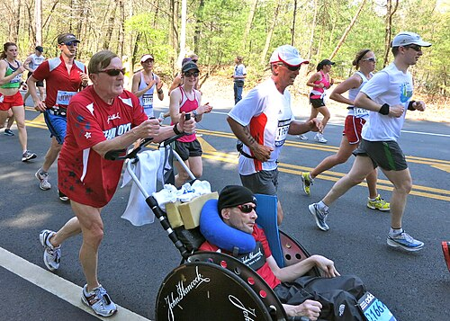 FinalTelegraph's tweet photo. True story:

In 1962, doctors in Massachusetts looked at a newborn boy named Rick Hoyt and told his parents to lock him away in an institution. His umbilical cord had twisted around his neck during birth, cutting off oxygen to his brain and leaving him a quadriplegic with severe cerebral palsy.

"He will be a vegetable for the rest of his life," the physicians said.

His father, Dick Hoyt, looked at the way Rick’s eyes tracked movement across the room and refused to believe the diagnosis. He and his wife brought Rick home, read to him, taught him the alphabet, and treated him like any other boy.

When Rick turned eleven, a group of engineers at Tufts University built a specialized computer that allowed him to select letters on a screen by tapping the side of his head against a metal switch. Skeptics doubted he would understand how to use it. Everyone crowded around the monitor, waiting for his first words—expecting "Hi Mom" or "Hi Dad."

Instead, Rick tapped out two words: "Go Bruins."

It was the year the Boston Bruins were in the Stanley Cup Finals. Rick had understood every word spoken around him for eleven years.

Four years later, a local five-mile charity run was organized for a classmate who had been paralyzed in a sporting accident. Using his computer, Rick typed a message to his father: "Dad, I want to do that."

Dick Hoyt was thirty-seven years old, out of shape, and had never run more than a mile at a time. Still, the next morning, he gripped the handles of Rick’s heavy, clunky wheelchair and pushed his son across all five miles, wheezing across the finish line next to last.

That night, Dick was iced down and aching when Rick called him over to the computer screen and tapped out the sentence that altered the trajectory of both their lives:

"Dad, when I’m running, it feels like I’m not handicapped."

Dick Hoyt made a silent vow in that room: if speed made his son feel free, he would lend Rick his own body for as long as his heart could beat.

Dick began training before dawn every day, strapping a hundred-pound bag of cement into the wheelchair while Rick was at school just to build his lungs. Over the next four decades, father and son completed 1,130 endurance races together—including 32 Boston Marathons, a 3,735-mile run and bike across the United States in 45 days, and six grueling Ironman Triathlons.

During an Ironman, Dick would swim 2.4 miles in open water while towing Rick behind him in a small rubber boat tied to his waist, immediately transition to a custom two-seater bicycle to pedal both of them 112 miles, and then strap on running shoes to push Rick 26.2 miles to the finish line.

At the height of their racing years, elite marathoners asked Dick why he never entered a single race alone just to see how many trophies he could win without pushing over a hundred pounds of extra weight.

Dick didn't hesitate. "I have zero desire to take a single step out there by myself," he said. "I am only lending Rick my arms and legs. He is the one lending me his heart."

Most people hit a wall in life because they are only fighting for their own comfort. Self-interest is a fragile fuel; the moment pain, exhaustion, or failure sets in, the mind looks for an exit because it is easy to negotiate with your own excuses.

True endurance is unlocked the moment your discipline becomes the vessel for someone else’s survival, dignity, or freedom. When the people you love depend on your strength, exhaustion loses its vote. Find a mission larger than your own comfort, and you become nearly impossible to break.
