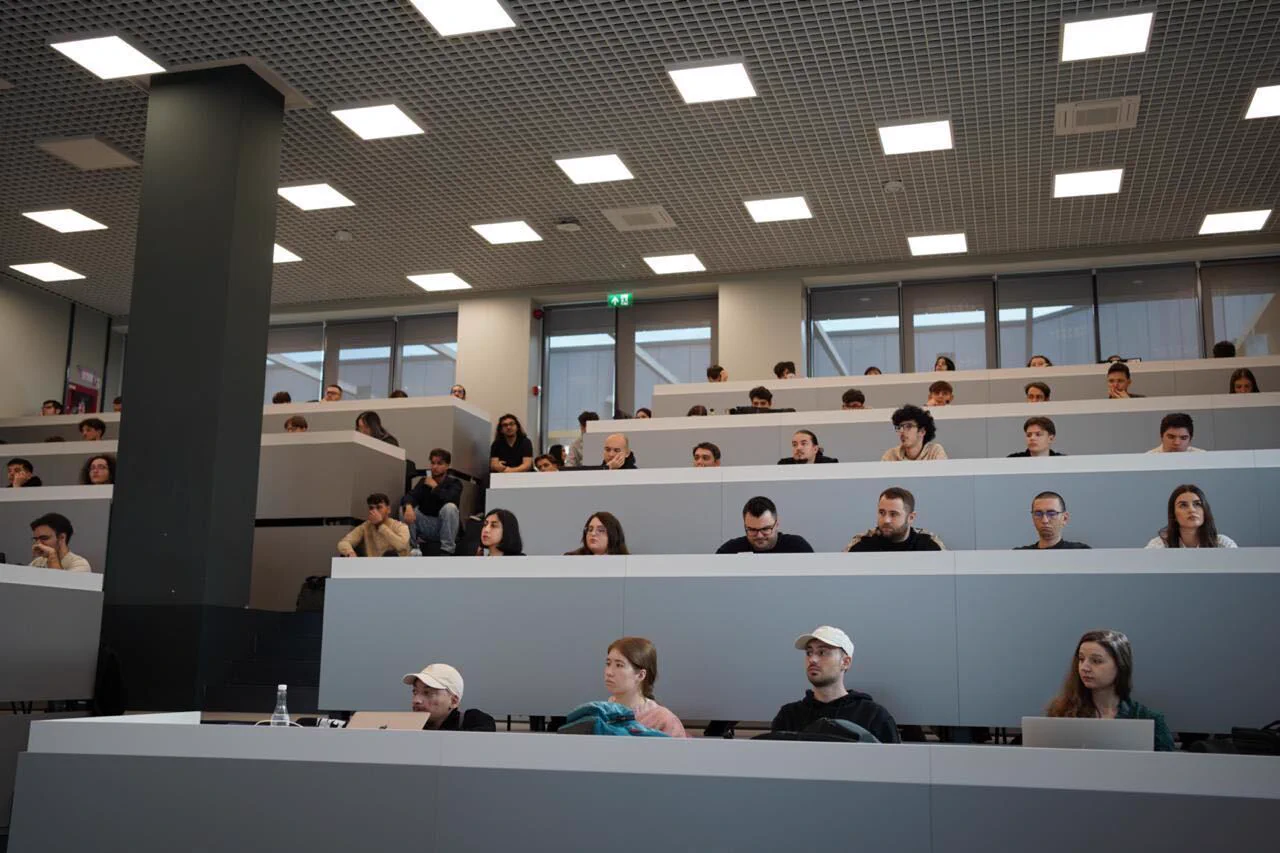 Students seated, listening to instructions at a WP Credits event. 