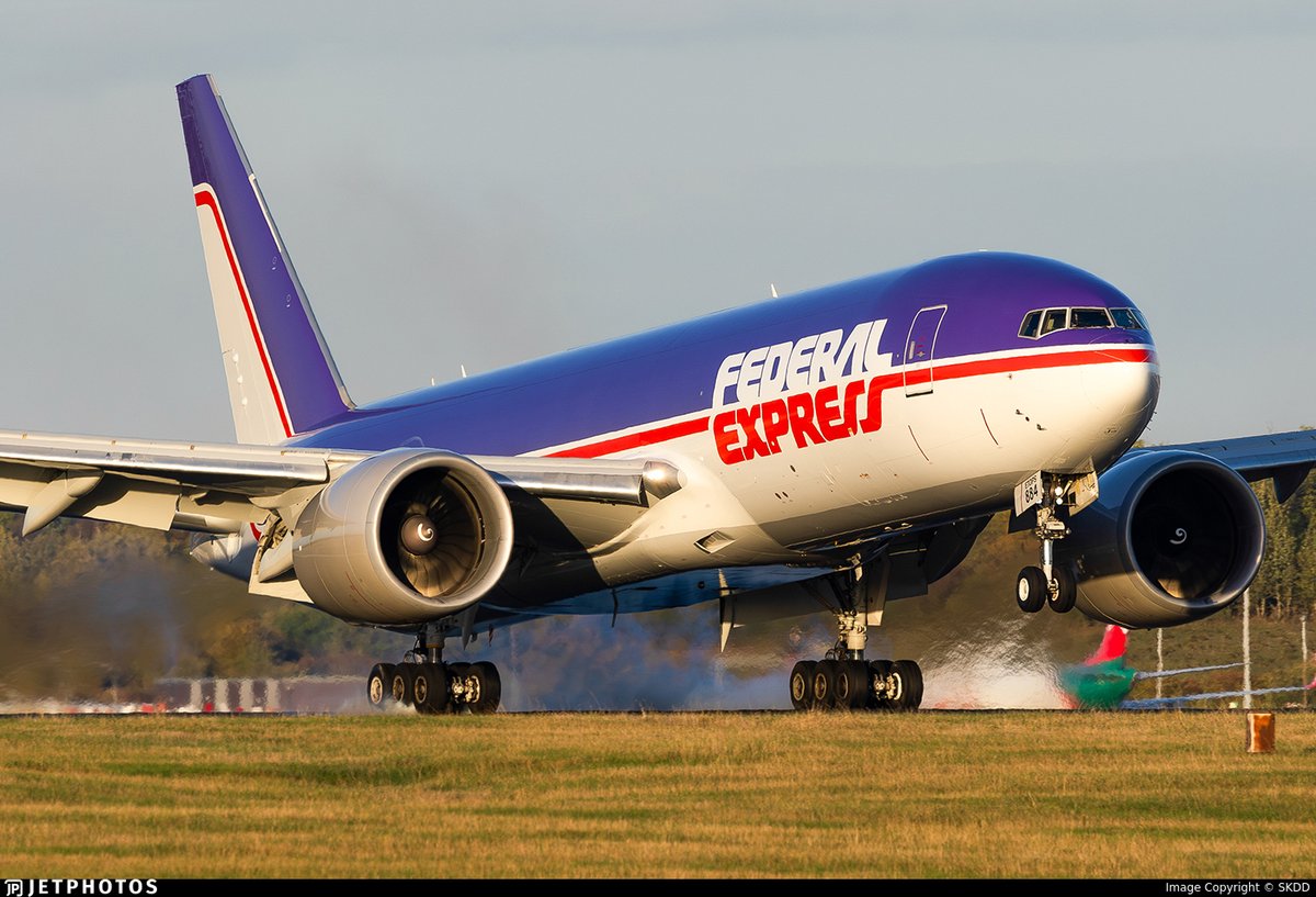 JetPhotos's tweet photo. FedEx’s retro livery 777 touching down in London. https://t.co/Mukjymi6pQ © SKDD https://t.co/pq9oTMDe3n