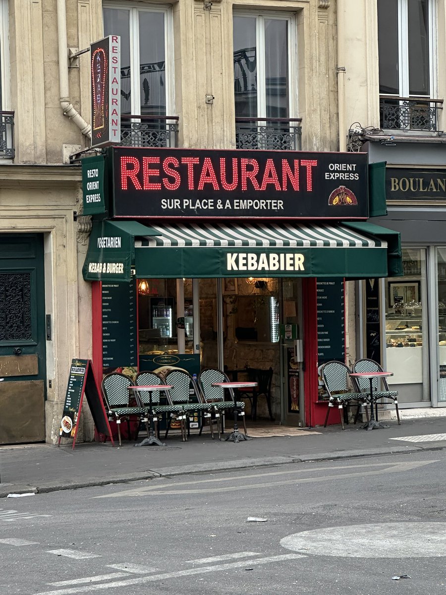 Cathalleslie's tweet photo. A little French miracle. Every single shop on this street is graffitied, damaged or looted. Except the kebab shop. Resilient. https://t.co/jctzyBJ6Jv