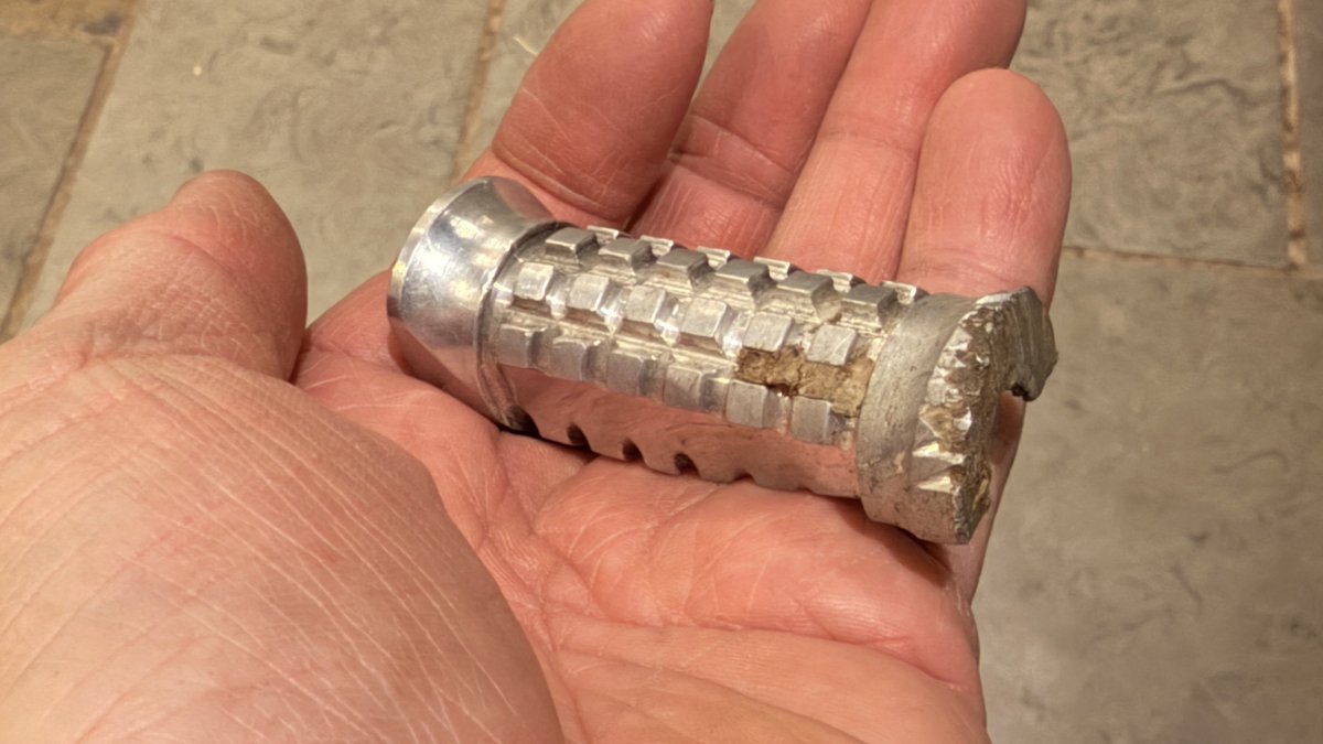 TobyMoody's tweet photo. Found it. A foot peg from Criville’s Repsol Honda that was in the crash with Mick Doohan at Eastern Creek 500cc Grand Prix 1996. Still got the mud on it from ‘Straya. https://t.co/M52ZZExek5