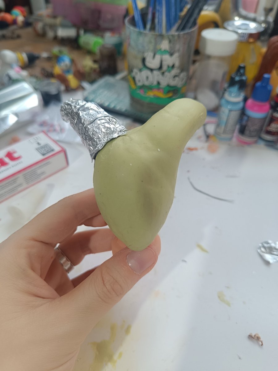 hellishbirb's tweet photo. //[Part 2] Make the other horn and keep sculpting the face. I also drilled into the back of his head, filled it with foil, and added more Milliput.

Blitzo has such a weird *Invader Zim*-style head, and this is my first time trying to replicate it.  Let's just hope I can. ✊ https://t.co/M2STG9lVNa