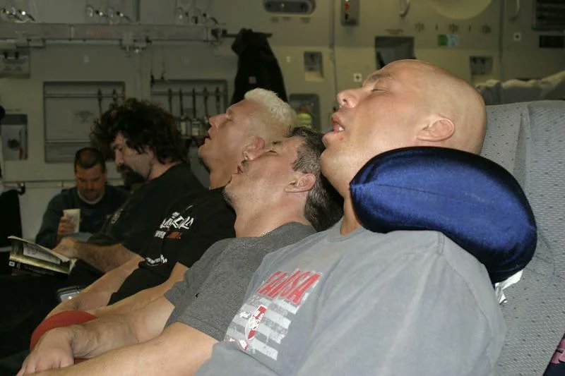 WrestleClips's tweet photo. Rare photo of Kurt Angle, Eddie Guerrero, Mick Foley, &amp; Heidenreich sleeping on a plane (2004) https://t.co/X4eR4p2bt2