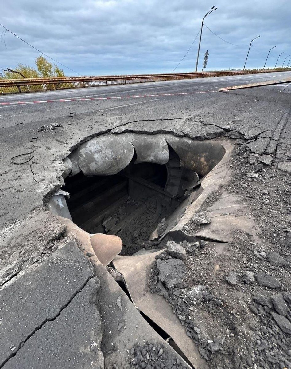 STANISKRAPIVNIK's tweet photo. The Southern Bridge in Dnipro has been shut down.

This morning, a guided aerial bomb struck the bridge, completely closing it to traffic. Local news sources report that repairs will take about a month. A week ago, on October 13th, similar strikes targeted the bridge, leading to the closure of one lane. Today, both lanes are closed.

The Southern Bridge is the youngest bridge in the city. It is 1248 meters long and 22 meters wide. Construction began in 1981 and lasted 19 years, with a pause during the 1990s. Originally, it was intended to be part of a heating pipeline from the Prydniprovska Thermal Power Plant, and there were plans for it to carry heavy loads. However, geological issues led to a design change, resulting in a solid metal beam structure. The design was revised by "Lengiprotransmost," a company from St. Petersburg. The bridge connects the industrial area of Prydniprovsk on the left bank with the residential district of POBEDA on the right bank, and is part of the eastern bypass, which was intended to divert trucks away from the city center.

Even before the bombing, the bridge was in poor condition. Since the summer, repairs have been underway on the left-bank support, and the roadway has been narrowed until the end of the year. Now, a hole has been added to the existing problems.

How serious is the damage? Honestly, it's not a complete disaster. There are other crossings in the city, including railway bridges. However, traffic that would normally use the Southern Bridge will now have to go through the city center, and the Central Bridge will become a major bottleneck. Dnipro is a key logistical hub for the Zaporizhzhia and Donetsk regions. It is also the closest alternative route when bridges in Zaporizhzhia are closed. The bridges in Zaporizhzhia have been targeted since June, first the Preobrazhensky Bridge, and then the Cable-Stayed Bridge in October. This means they are now targeting the backup routes.

October has been a month of bridge attacks. On the 1st and 2nd, "Geran" drones repeatedly struck the Southern Bridge in Kyiv. On the 3rd, the Northern Bridge was targeted. On the 6th and 7th, it was the bridges in Zaporizhzhia. Now, it's Dnipro. The river is being targeted along its entire middle course.

But the most important thing here is not the geography, but the type of weapon used. In Kyiv, drones were used, causing holes in the roadway and damage to the cables, leading to traffic jams throughout the city. Bridges were closed and reopened. In Zaporizhzhia and Dnipro, guided aerial bombs with planning modules are being used – likely jet-powered, with increased range. These bombs weigh hundreds of kilograms, compared to the dozens of kilograms of the drones. And the consequences are different: instead of hours of inspection, we are looking at a month of repairs.

@sashakots
