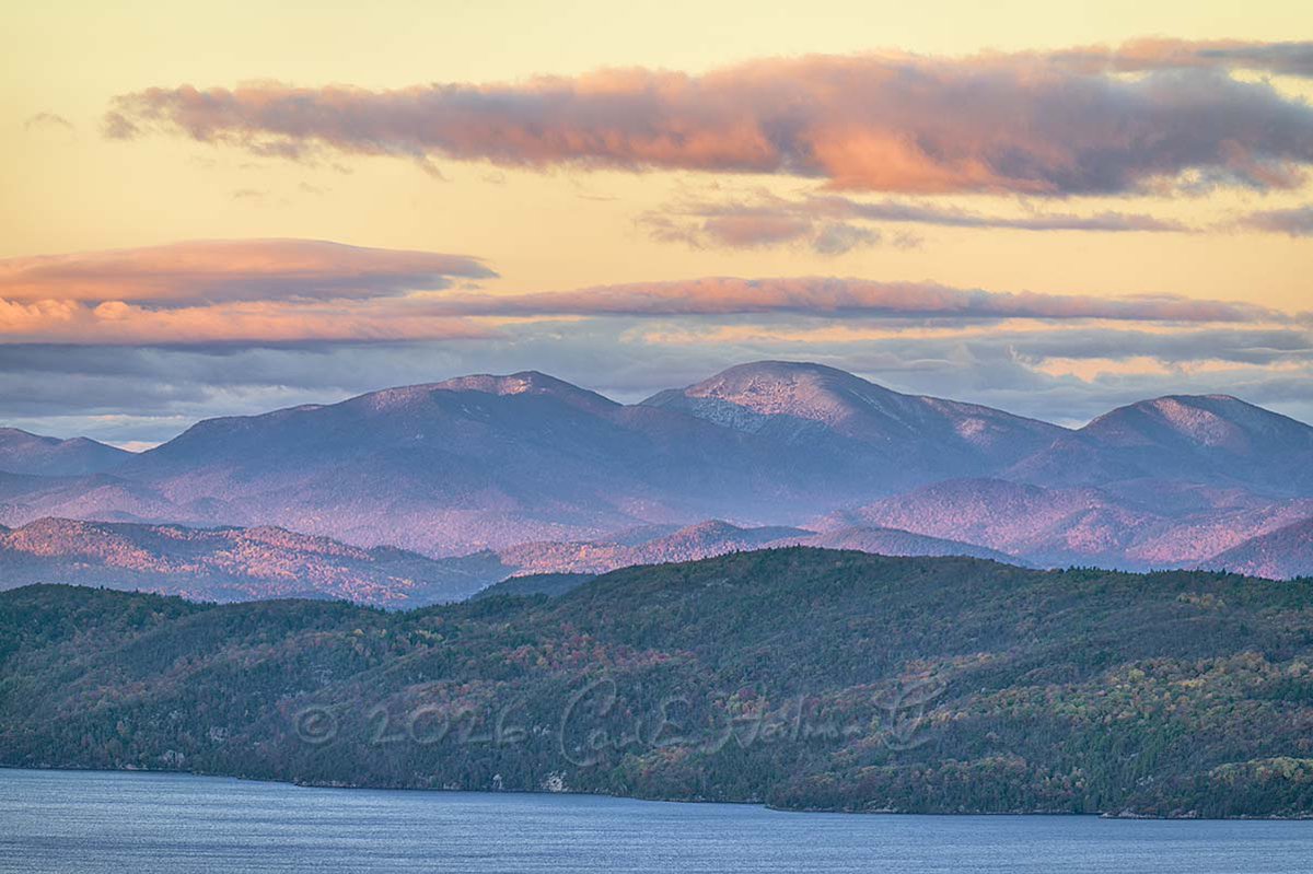 NaturePhotoTips's tweet photo. The glow of sunrise light on the clouds and snow capped Adirondack peaks on Sunday morning 10/18. https://t.co/AV9xg8xkfY
