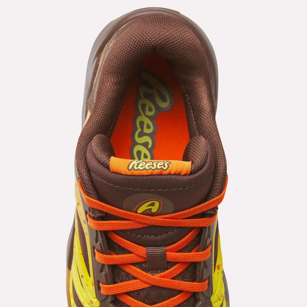NickDePaula's tweet photo. Angel Reese is launching the "Reese's" Reebok Angel 1s tomorrow, an official collab with @Reeses, with a theme inspired by the iconic candy. 

"We designed this colorway especially for my fans, for the Reese’s Pieces!" says @Reese10Angel https://t.co/n8yfzsrRXF