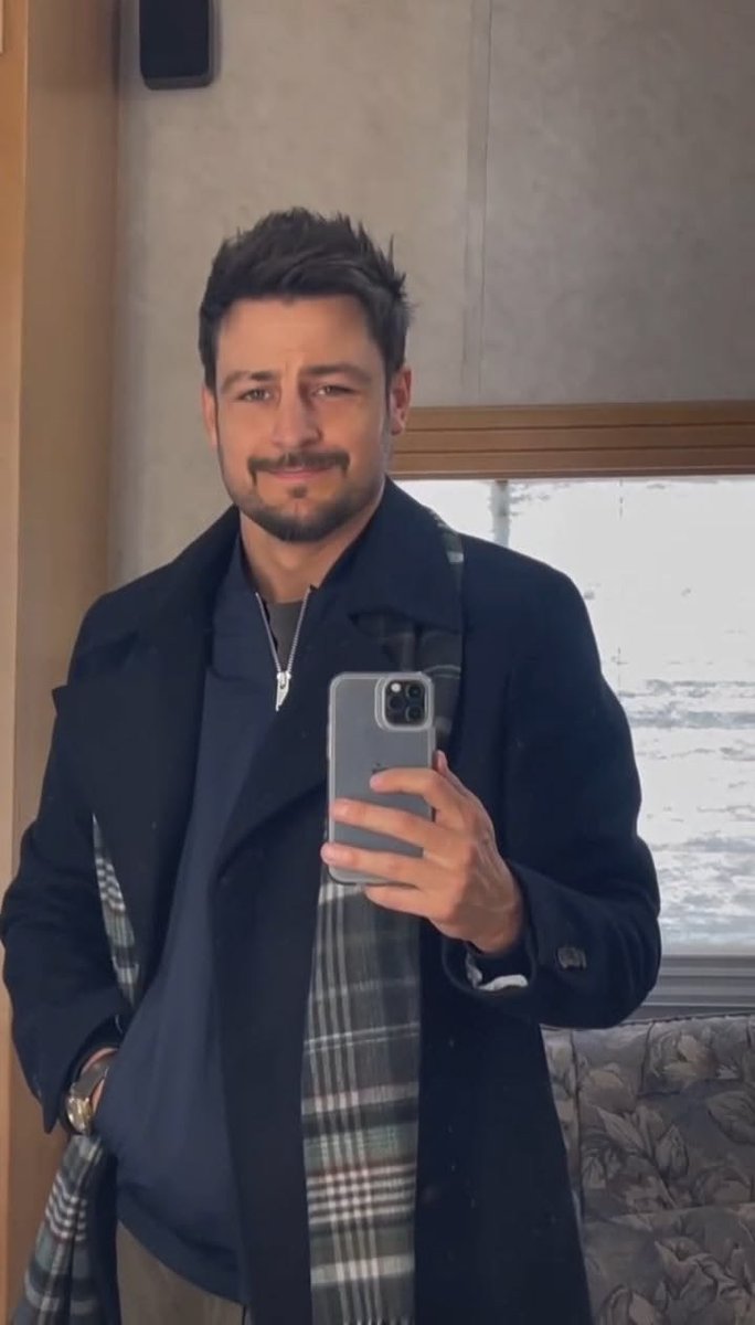 HynesHeart's tweet photo. A final mirror check before the cameras roll. The set may be freezing, but the charm is bringing all the heat. Ladies, stay cozy and tell me, who’s ready for a little Tyler Hynes magic on screen? 🎬🤍

#TylerHynes #Hynies #Hallmark #OnSet #LeadingMan #WinterVibes #HallmarkHunk https://t.co/DnMR40Q5B3
